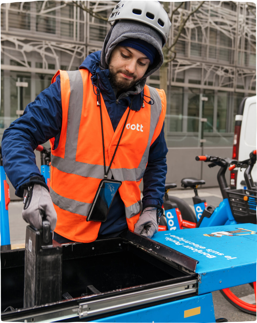 A Dott street team member swapping batteries on our scooters and bikes to ensure they’re fully charged.